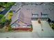 Aerial view of an attractive brick home with a two-car garage and landscaped grounds at 4321 Lanier Ridge Walk # 1704, Cumming, GA 30041