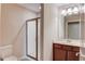 Bathroom featuring a glass shower, modern vanity, and well-lit mirror and fixtures at 4321 Lanier Ridge Walk # 1704, Cumming, GA 30041