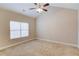 Spacious bedroom with a vaulted ceiling, large window, and neutral carpeting at 4321 Lanier Ridge Walk # 1704, Cumming, GA 30041