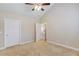 Neutral bedroom with carpet, a vaulted ceiling, and white trim at 4321 Lanier Ridge Walk # 1704, Cumming, GA 30041