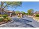 Gated entrance with brick pillars in residential community with beautiful landscaping and trees at 4321 Lanier Ridge Walk # 1704, Cumming, GA 30041