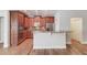 Kitchen with stainless steel appliances, granite countertops, and wood cabinets at 4321 Lanier Ridge Walk # 1704, Cumming, GA 30041