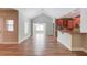 Open-plan living space featuring hardwood floors, a kitchen with granite countertops, and lots of natural light at 4321 Lanier Ridge Walk # 1704, Cumming, GA 30041