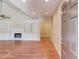 Inviting living room with gleaming hardwood floors, built-in shelving, and a cozy fireplace at 4321 Lanier Ridge Walk # 1704, Cumming, GA 30041