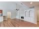 Bright living room with hardwood floors, fireplace with built-ins, and an open floor plan at 4321 Lanier Ridge Walk # 1704, Cumming, GA 30041