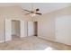 Large main bedroom with a ceiling fan and multiple doors leading to other rooms at 4321 Lanier Ridge Walk # 1704, Cumming, GA 30041