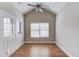 Sunroom featuring hardwood floors, a vaulted ceiling, and lots of natural light at 4321 Lanier Ridge Walk # 1704, Cumming, GA 30041
