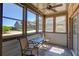 Inviting sunroom with tiled flooring, multiple windows, and comfortable seating with natural light at 4321 Lanier Ridge Walk # 1704, Cumming, GA 30041