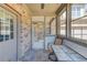 Cozy sunroom featuring tiled flooring, a table with chairs, and exterior views at 4321 Lanier Ridge Walk # 1704, Cumming, GA 30041