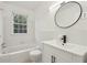 Bright bathroom with modern black faucet and white tiled walls at 55 Delmont Ne Dr # D1, Atlanta, GA 30305