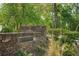 The Duck Pond Park entrance with stone wall and landscaping at 55 Delmont Ne Dr # D1, Atlanta, GA 30305