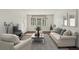 Bright living room with neutral tones, modern furnishings, and ample natural light, creating a comfortable and inviting space at 55 Delmont Ne Dr # D1, Atlanta, GA 30305