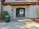 Community pool house with stone facade and arched entrance at 55 Delmont Ne Dr # D1, Atlanta, GA 30305