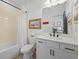 Cozy bathroom with a shower/tub combo, stylish vanity, and decorative accents at 1004 Baldwin Dr, Milton, GA 30009
