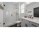 Modern bathroom featuring a glass enclosed shower, stylish vanity, and neutral finishes at 1004 Baldwin Dr, Milton, GA 30009