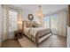 Cozy bedroom with hardwood floors, neutral décor, and decorative light fixture at 1004 Baldwin Dr, Milton, GA 30009