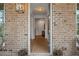 Inviting entryway featuring a hardwood floor, stylish lighting, and elegant decor at 1004 Baldwin Dr, Milton, GA 30009