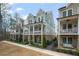 Charming home featuring a double-decker front porch, brick foundation and stylish facade at 1004 Baldwin Dr, Milton, GA 30009
