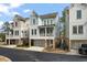 Charming new construction townhomes showcasing varied siding and attached garages at 1004 Baldwin Dr, Milton, GA 30009