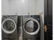 A laundry room with modern appliances and overhead cabinets for efficient storage at 1004 Baldwin Dr, Milton, GA 30009