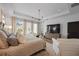 Spacious main bedroom with a decorative light fixture, sitting area, and multiple windows for natural light at 1004 Baldwin Dr, Milton, GA 30009