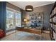Home office featuring a glass desk, bookshelves, and ample natural light at 1004 Baldwin Dr, Milton, GA 30009