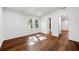 Bright bedroom features wood flooring, white walls, and an ensuite bathroom at 1027 Mount Airy Sw Dr, Atlanta, GA 30311