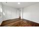 Bright bedroom with wood flooring and white walls, showing doors and lots of light at 1027 Mount Airy Sw Dr, Atlanta, GA 30311