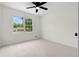 Bright bedroom featuring a ceiling fan and window overlooking the neighborhood at 3107 Park Ln, Snellville, GA 30078