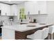 Updated kitchen with white cabinets, quartz countertops, and stainless steel appliances at 3107 Park Ln, Snellville, GA 30078
