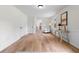 Light-filled living space with hardwood floors, wainscotting, and minimalist decor at 3107 Park Ln, Snellville, GA 30078