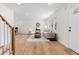 Open concept living room with hardwood floors, neutral decor, and ample natural light at 3107 Park Ln, Snellville, GA 30078