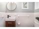 Modern bathroom featuring a sleek vanity, updated fixtures, and classic white tile walls at 3200 Rehoboth Dr, Decatur, GA 30033