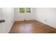 Bright bedroom features hardwood floors and a window providing natural light at 3200 Rehoboth Dr, Decatur, GA 30033