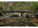 Charming single-story home with a well-manicured lawn and lush landscaping at 3200 Rehoboth Dr, Decatur, GA 30033