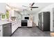 Modern kitchen with stainless steel appliances, sleek white cabinets, and a stylish vent hood at 3200 Rehoboth Dr, Decatur, GA 30033