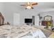 A spacious bedroom with furniture, ceiling fan, and good natural lighting at 5260 Sherwood Way, Cumming, GA 30040
