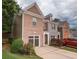 Charming brick front home with attached garage, landscaped yard and a traditional architectural design at 5260 Sherwood Way, Cumming, GA 30040