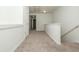 Spacious upstairs hallway with neutral carpet and white trim showcases natural light and access to bedrooms at 5260 Sherwood Way, Cumming, GA 30040