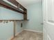 Laundry room with tiled floor and storage shelving at 5260 Sherwood Way, Cumming, GA 30040