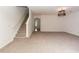 Cozy living room with carpet and a staircase adjacent to the entrance hallway at 5260 Sherwood Way, Cumming, GA 30040