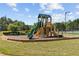 The neighborhood playground features a fun slide and play structure for children at 5260 Sherwood Way, Cumming, GA 30040