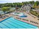 A swimming pool and splash pad featuring numerous lounge chairs offer a relaxing and fun recreational space at 5260 Sherwood Way, Cumming, GA 30040