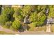 Aerial view of a charming home surrounded by mature trees in a peaceful neighborhood at 111 Amberwood Ln, Euharlee, GA 30145