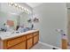 Bathroom with double sink vanity, large mirrors, and walk-in shower at 111 Amberwood Ln, Euharlee, GA 30145