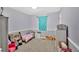 Cozy bedroom featuring a large window and plenty of toy storage at 111 Amberwood Ln, Euharlee, GA 30145