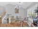 Dining room with decorative chandelier and stairway access at 111 Amberwood Ln, Euharlee, GA 30145