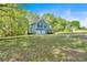 Charming blue two-story home with a two-car garage and welcoming front porch at 111 Amberwood Ln, Euharlee, GA 30145