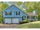 Charming two-story home with a two-car garage and a manicured lawn at 111 Amberwood Ln, Euharlee, GA 30145