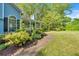 Charming home exterior with lush landscaping and a welcoming walkway to the front porch at 111 Amberwood Ln, Euharlee, GA 30145